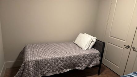 2 twin mattresses with the frames