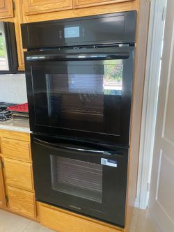 Frigidaire Double Oven/Samsung Microwave over counter/ drawer dishwasher and Black Fridge