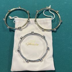 Set of 3 gold & silver slip-on Bracelets with clear gemstones 