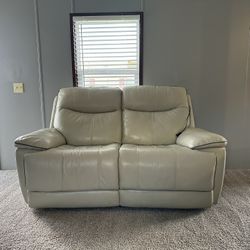 Beige leather 2 seater recliner