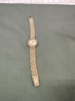 Lady's 14k Gold watch set with Diamond Bezel