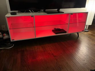 Tv stand fits up to a 75 inch had lights and remote moving soon can’t take asking 175