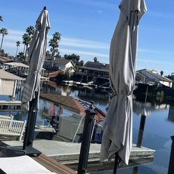 2 Umbrellas + 2 120 LB’S rolling base