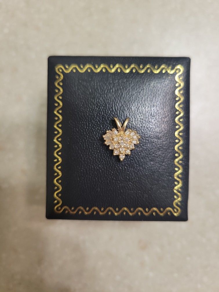 14 K Gold Diamond Pendant. Weight Is 1.5 Grams
