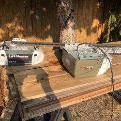 2 Garage Door Openers  1 Genie 1 Liftmaster