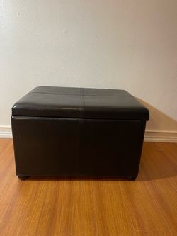 Black faux leather ottoman with storage