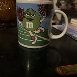 - 2003 M&M’S Green Cheerleader & Blue Football Fan Holding Flag Mug 