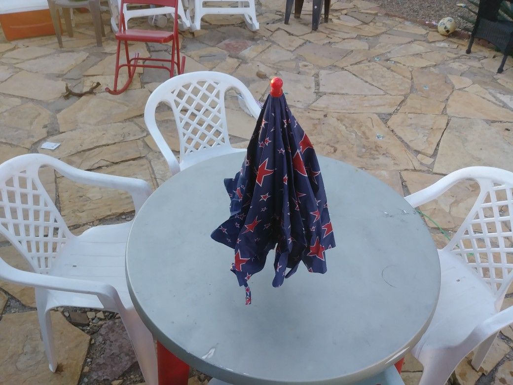 Patio table, chairs and umbrella