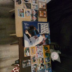 MLB Nolan Ryan, Autographed Book, Autographed Baseball, And 32 Sports Cards.