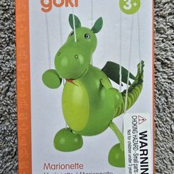 A wooden Dino puppet toy