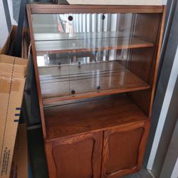 Wooden cabinet with glass doors