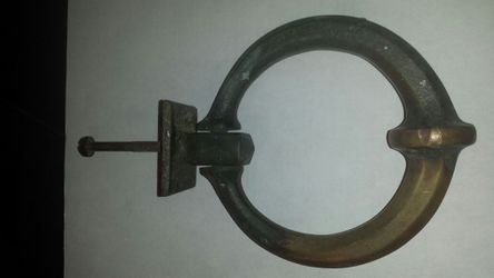 Solid brass knocker with strike plate