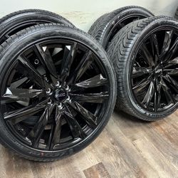 New 24 inch gloss black Gm style wheels wrapped in Lexani 305/35r24 tires