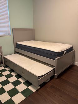 Light gray Twin bed with trundle and mattresses