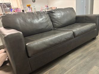 Dark brown leather/ faux leather sofa and love seat