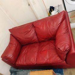 extremely comfortable Italian leather red love seat. 