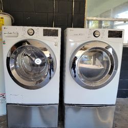 LG Washer and Dryer W/ Storage Stand MAKE AN OFFER. MUST GO TODAY