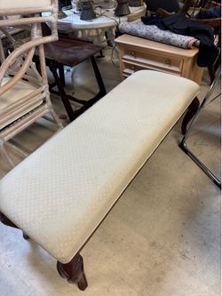 Queen Anne Style Bench features a light upholstered seat and cherry wood legs - 52” x 18”