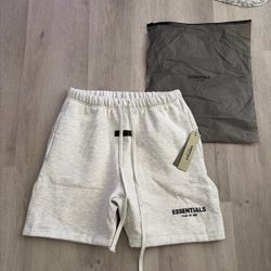 Fear Of God Essentials light grey sweatshorts