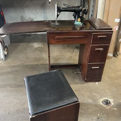 Vintage Singer Sewing Machine with cabinet and seat