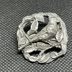 This is a vintage Birds & Blooms 1999 pewter cardinal bird brooch pin