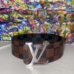 Louis Vuitton LV Initiales 40MM Reversible belt in Damier Ebene canvas with a silver-tone buckle. 