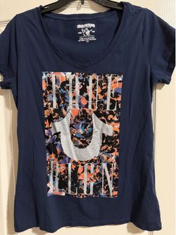 True Religion, women’s large, blue with multicolored design and white beaded logo, short sleeve shirt.