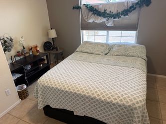 Queen bed with entertainment table