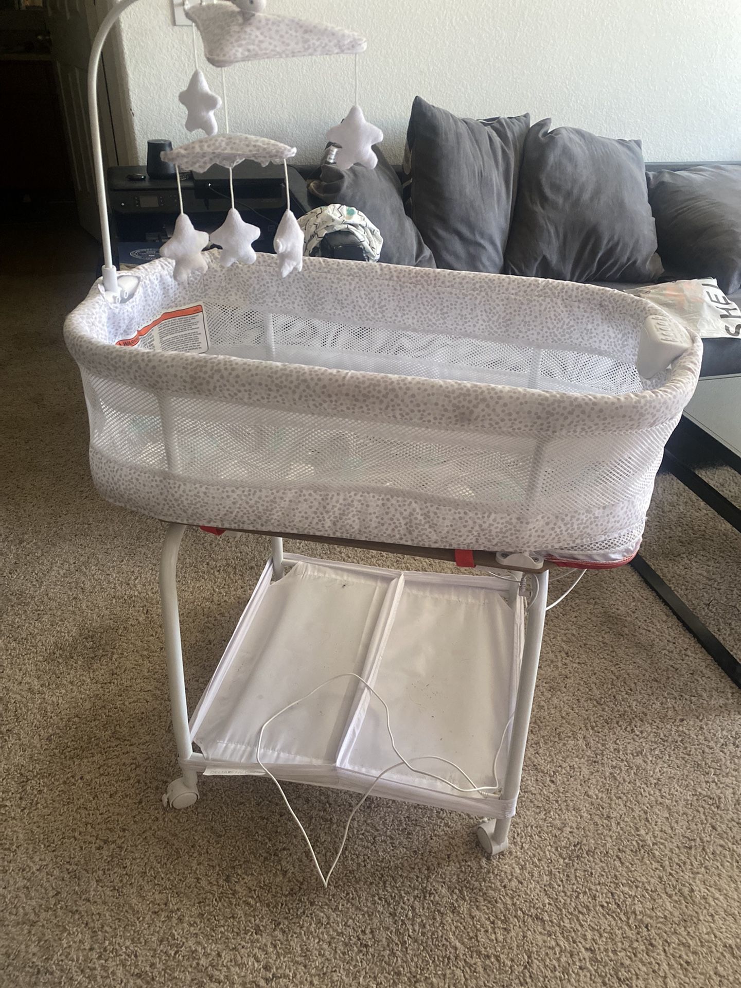 Delta Children Auto Glide Bassinet with Bluetooth