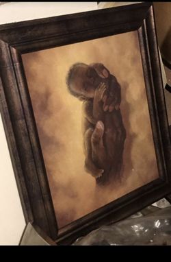 Frame art , hands holing baby