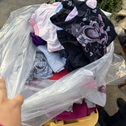 full bag of children’s clothes 