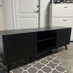 Black tv stand and  entertainment center