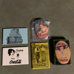 Coca-Cola collectibles. Tin Sewing kit, and four mirrors.