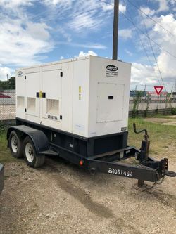 DRYCO Power Division trailer-mounted generator, labeled X080. It appears to be a towable industrial standby/rental-style generator housed in a weather
