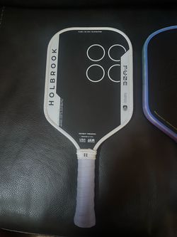 Several different pickleball paddles