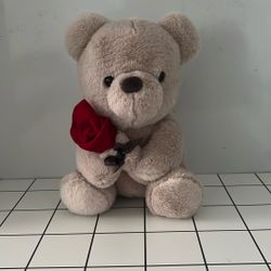 Cute Teddy Bear With A Rose