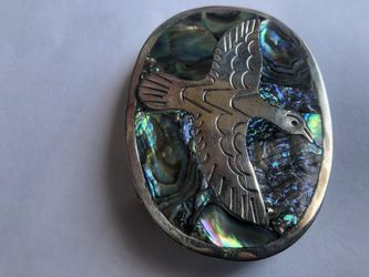 Silver/mother of pearl bird belt buckle