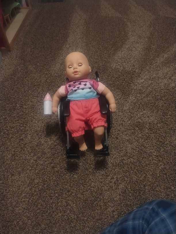 Baby On A Wheelchair