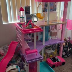 Barbie house, includes 2 Barbie cars, over 20 Barbie sets.
