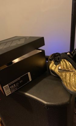 Gold and black foams size 10.5