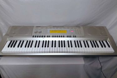 Casio WK-200 76 Key Piano Keyboard + Power Adapter + Stand