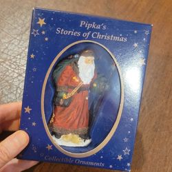 Pipka’s Stories Of Christmas Collectible Ornament 11403 Star Catcher 
Santa New in the box. Approximately 4" tall. UPC 33.
Weight 4oz plus s
