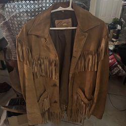 70s suade leather tassle biker jacket mmade by sportswear and it is a suede leather suede,