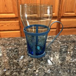 Vintage 1950’s Glass Cup with Metal Holder With Handle.  Size 5 1/2 inches tall. Never Used With Sticker On The Bottom “Counterpoint San Francisco”.  