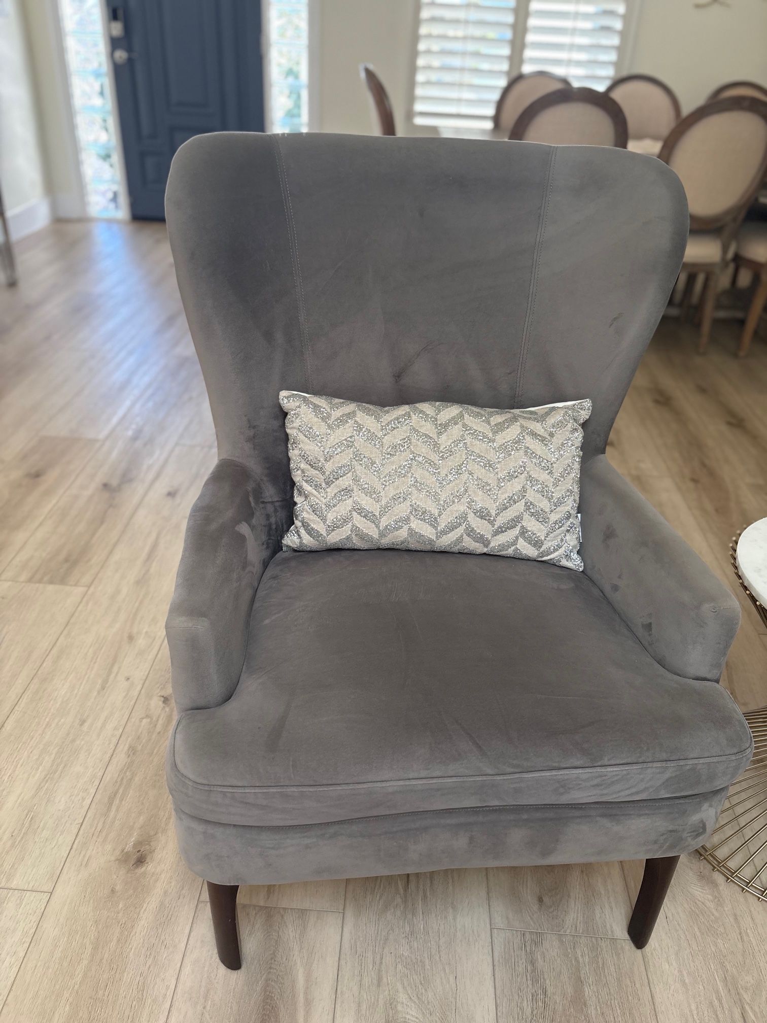 Two gray wingback chairs