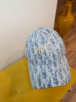 Female designer light blue hat