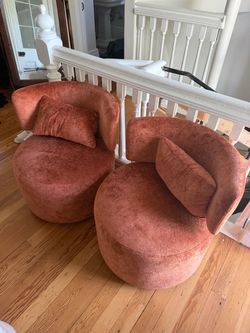 Orange round swivel chairs
