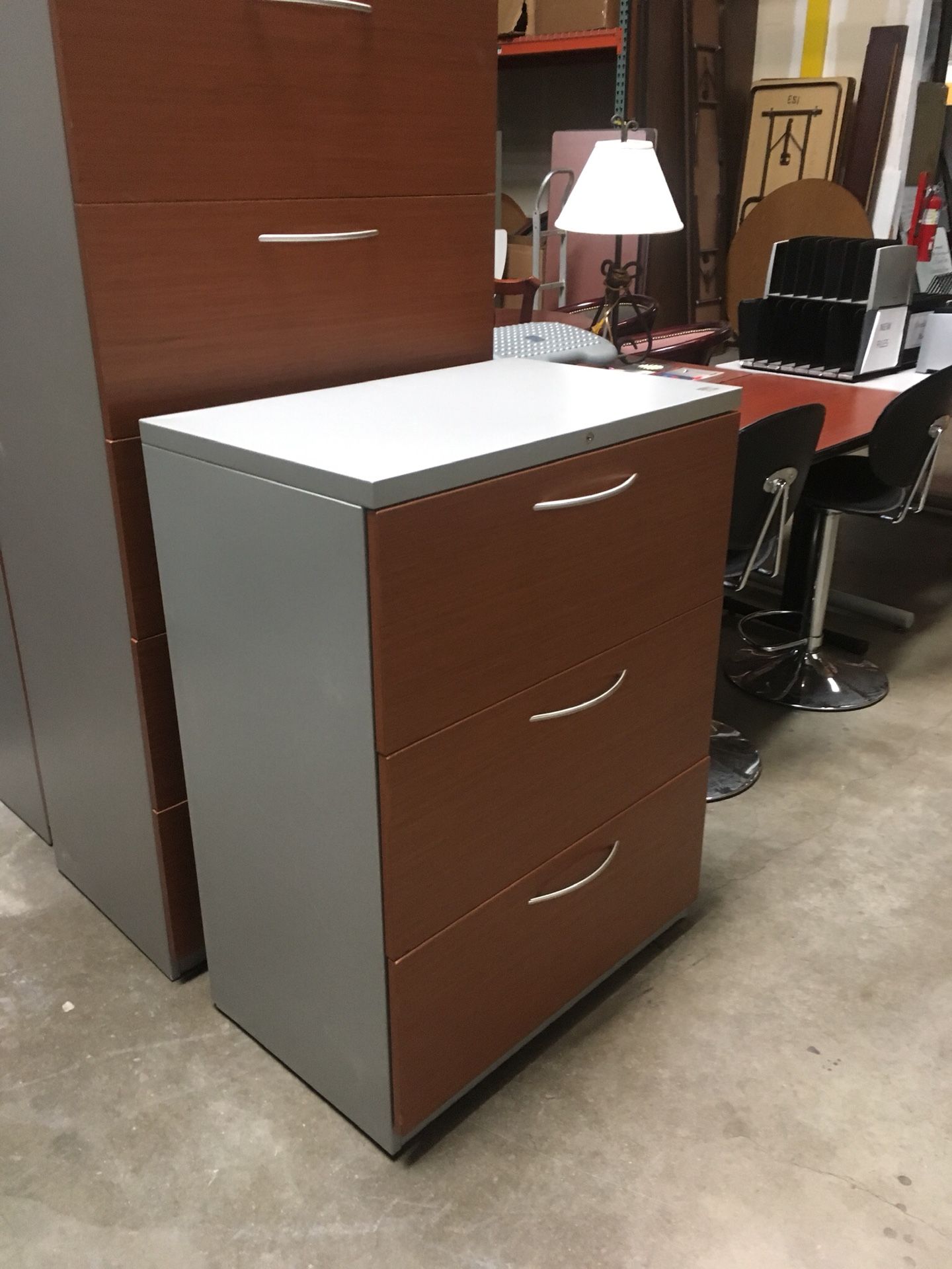 Soak his medium cherry and light gray lateral filing cabinets