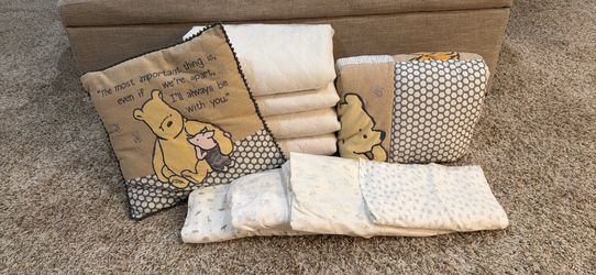 Classic Winnie the Pooh Baby Bedding Set plus waterproof quilted mattress pads and bonus sheets.