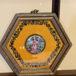 Vintage framed porcelain plaque that typically depicts a "courting couple"